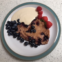 Gluten-free banana and blueberry pancake with coconut cream