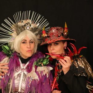 2 women dressed in fancy dress.