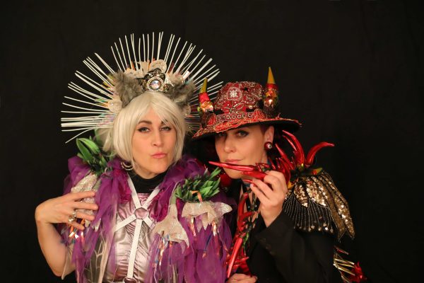 2 women dressed in fancy dress.