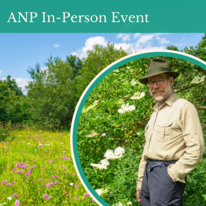 Man standing next to plants.
